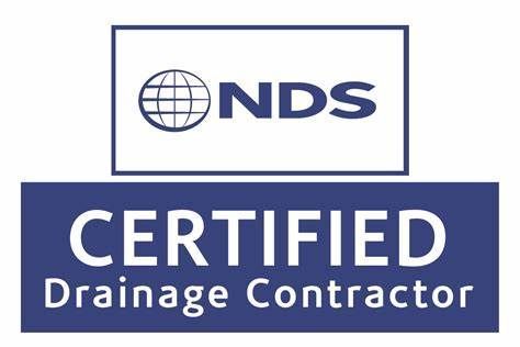 a nds certified drainage contractor logo on a white background .