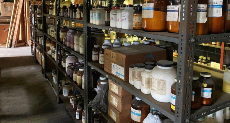 A warehouse filled with lots of chemicals on shelves.