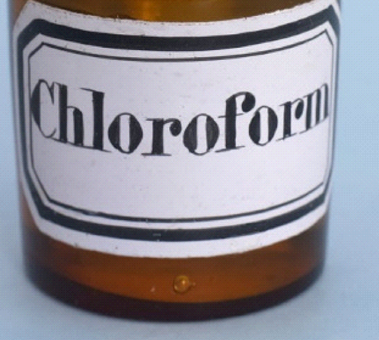 A brown bottle with a white label that says chloroform