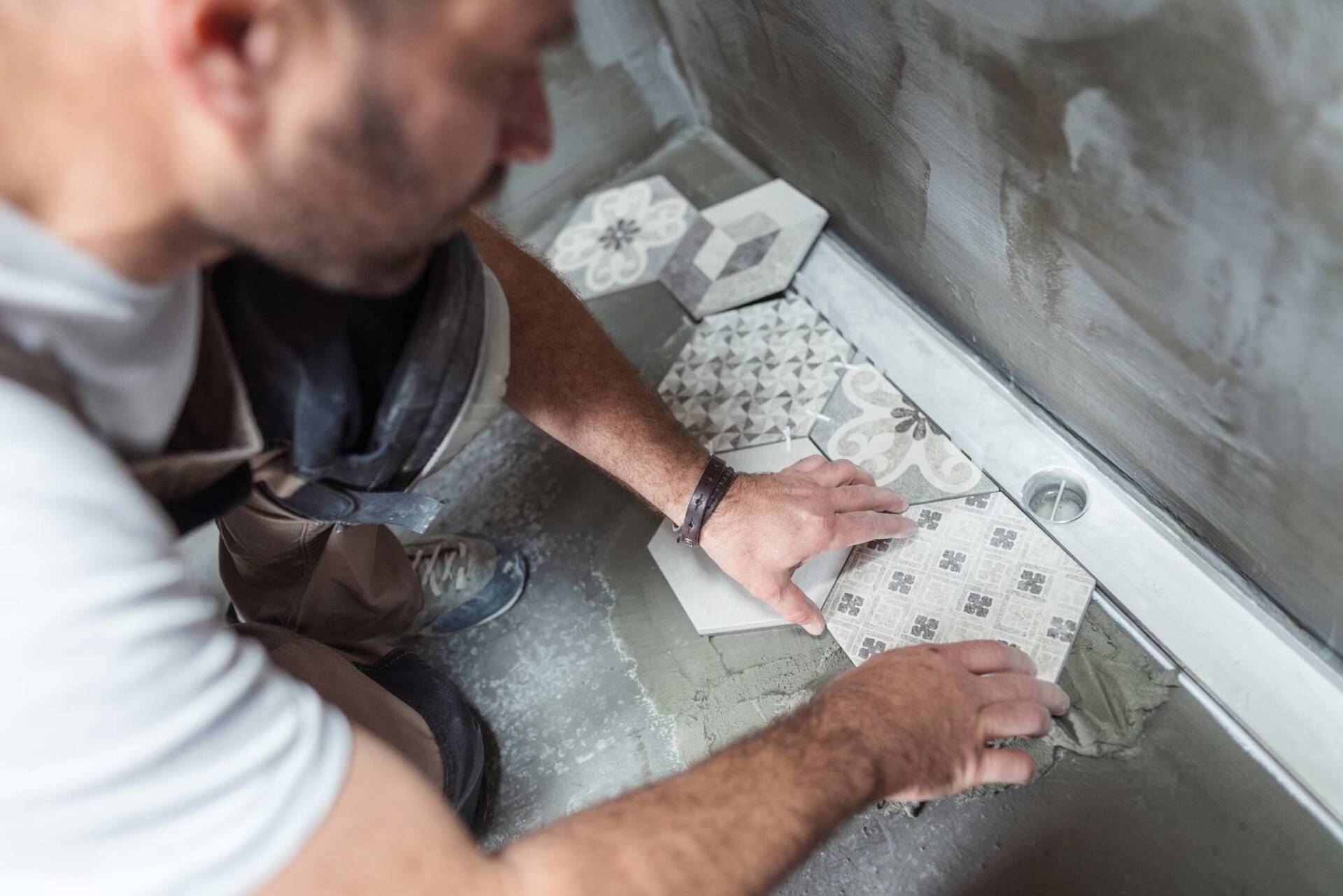 Installing Tiles On The Bathroom Floor — Greenville, NC — East Carolina Carpets & Interiors