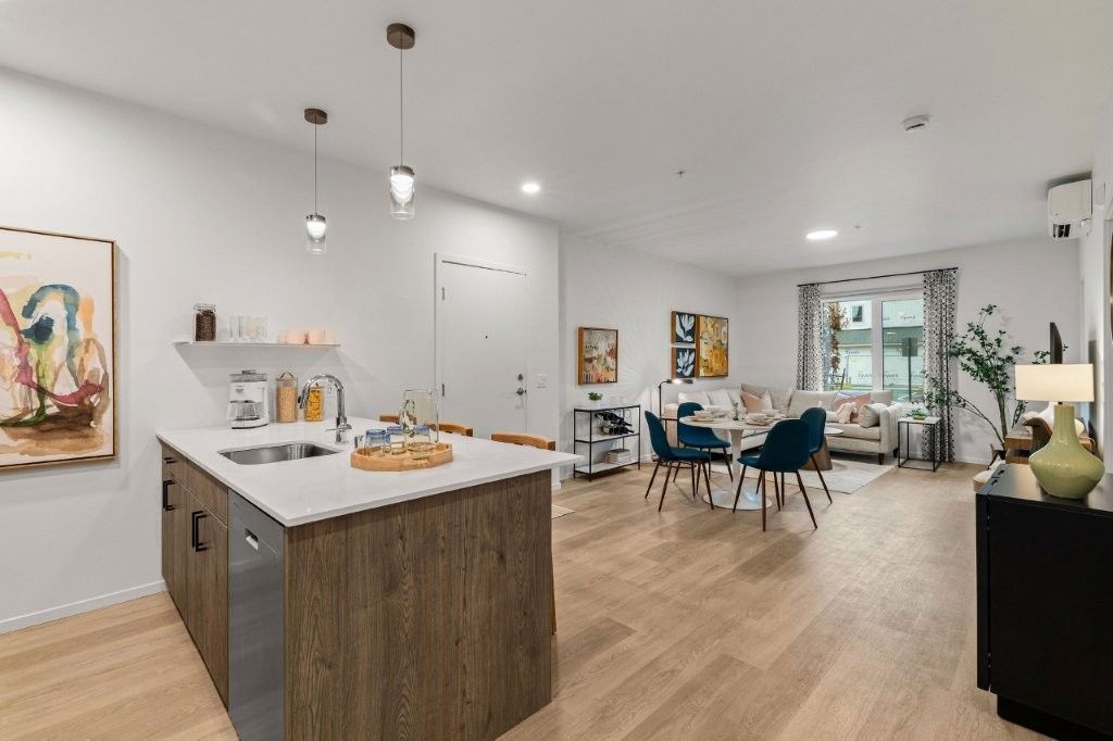 A kitchen with a large island in the middle of the room.