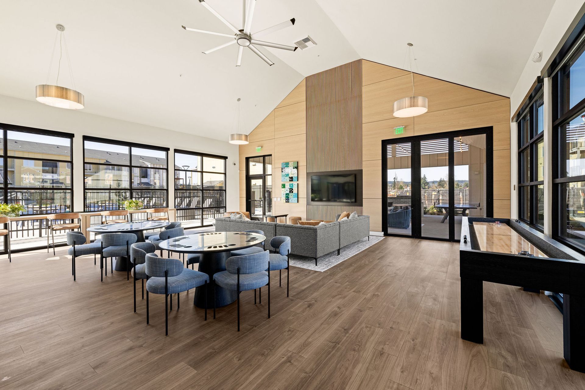 A large room with tables and chairs in it.