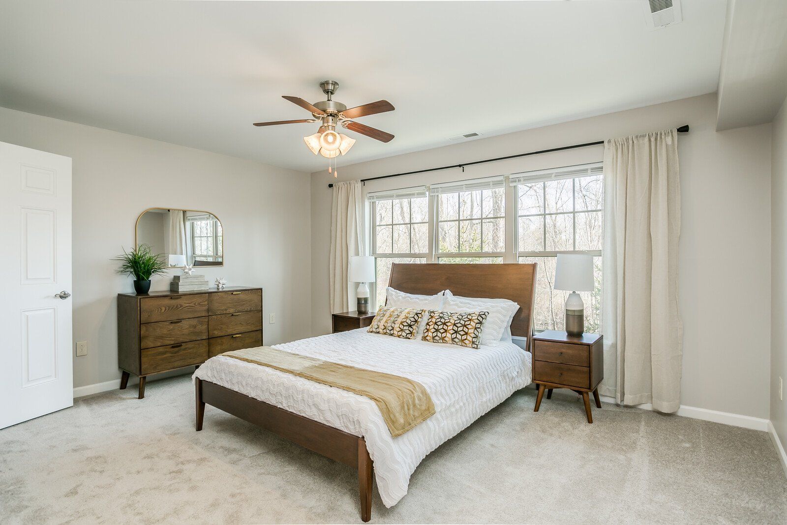 Large bedroom with great natural lighting and plush carpeting