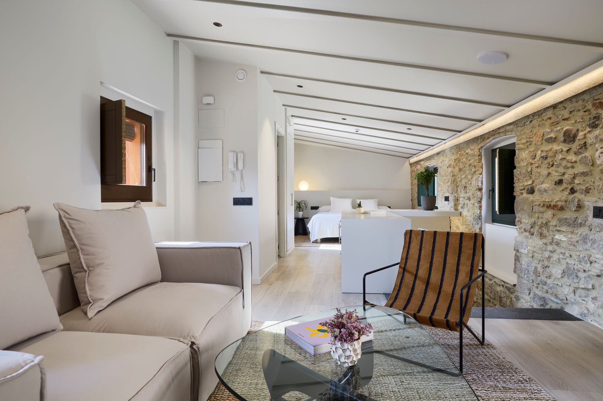 A living room with a couch , chair , and coffee table.