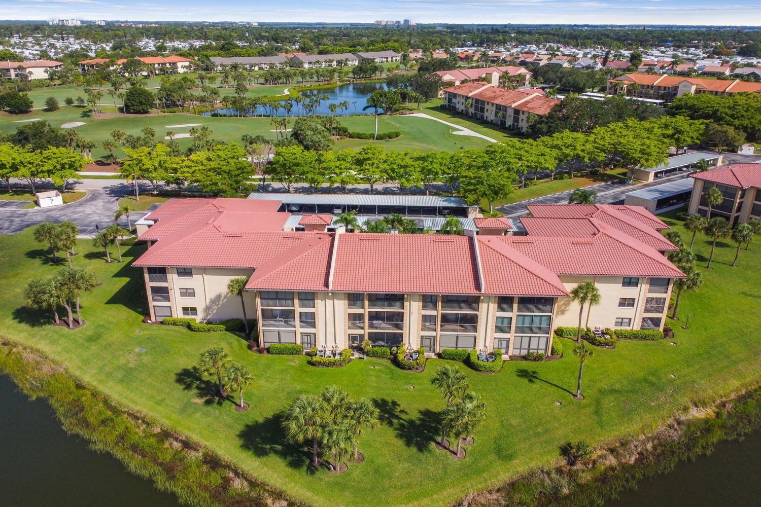 an aerial view of a large building with a red roof photo shoot by Craig Westerman