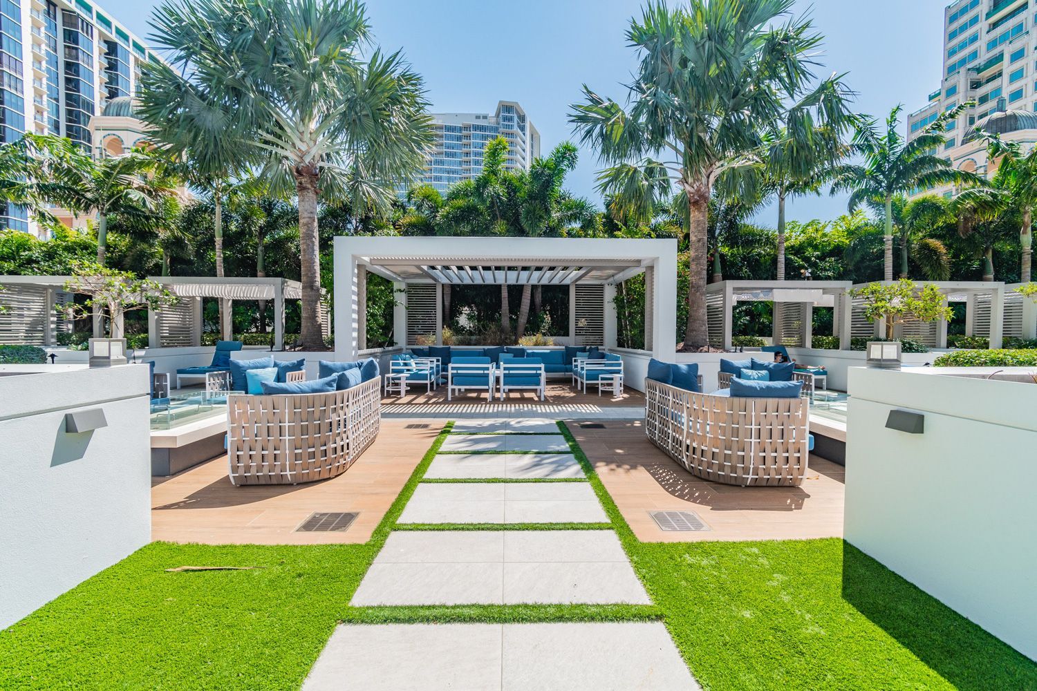 Beautiful home and patio area with a gazebo , couch , chairs , and palm tree shot by Craig Westerman.