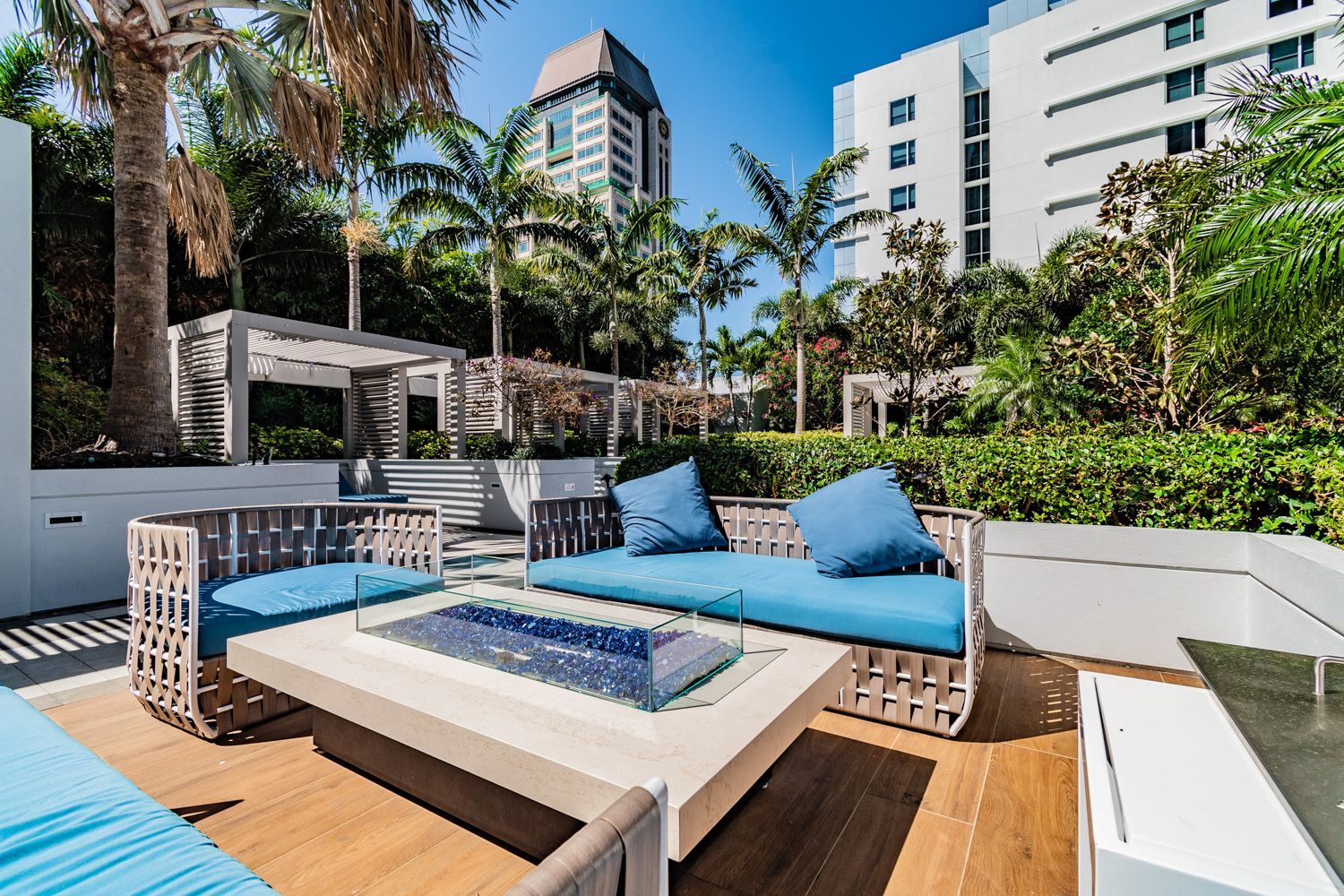 Beautiful St. Petersburg hotel court yard with patio with a couch and a table with a fire pit in the middle shot by Craig Westerman.