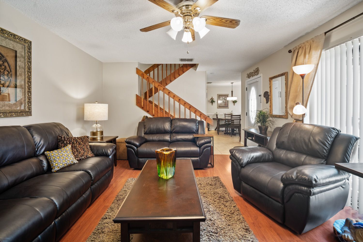 A living room filled with furniture and a ceiling fan in Tampa, Florida shoot by Craig Westerman and Team