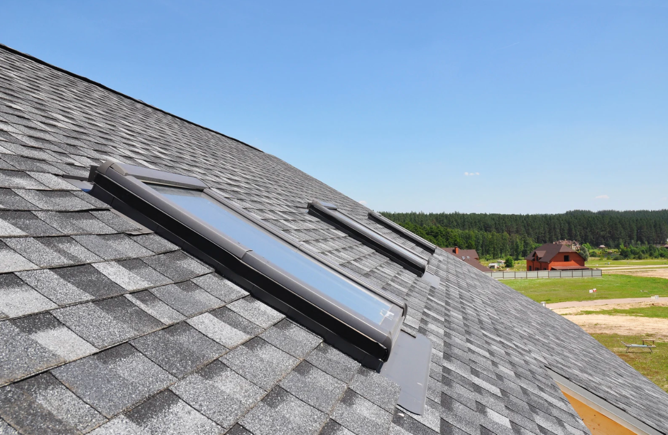 Residential home showing clean shingles and skylights from the outside