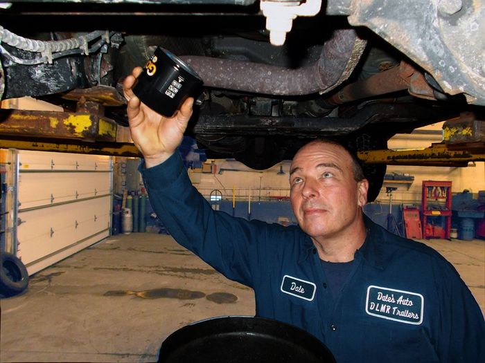 Auto Mechanic Holding Oil Filter During Routine Maintenance | Dale's Auto Service