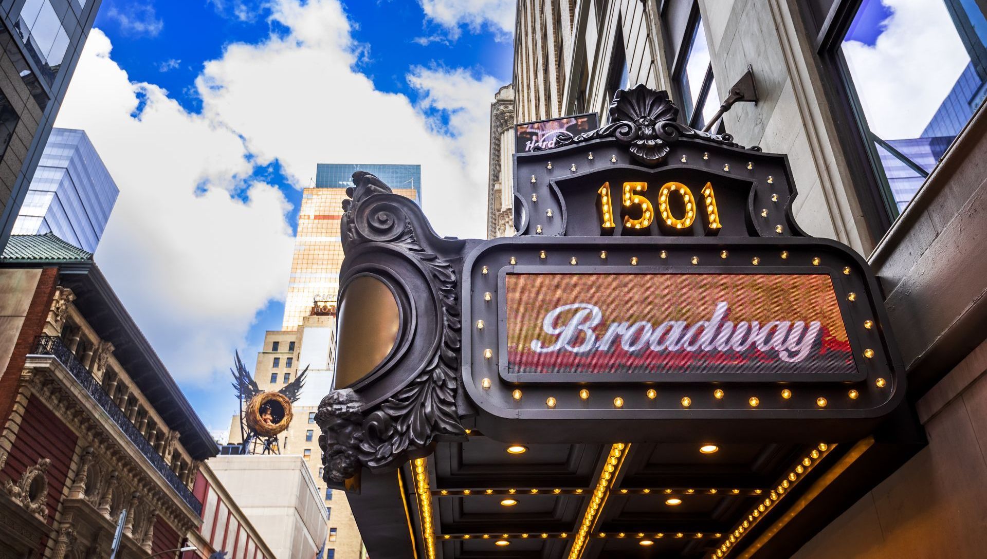 A sign for the broadway theater in new york city.