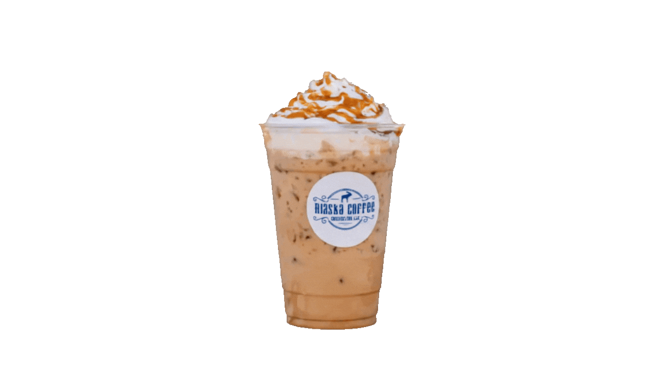 Iced coffee with whipped cream and caramel drizzle in a plastic cup with a logo, isolated on a white background.
