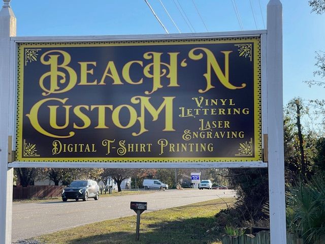 A sign for beach n custom vinyl lettering laser engraving digital t-shirt printing