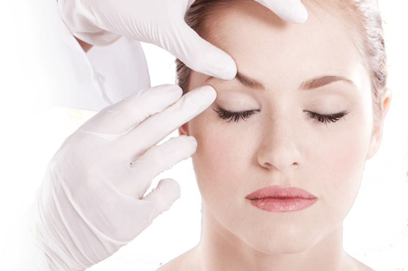 A woman is getting her eye examined by a doctor.