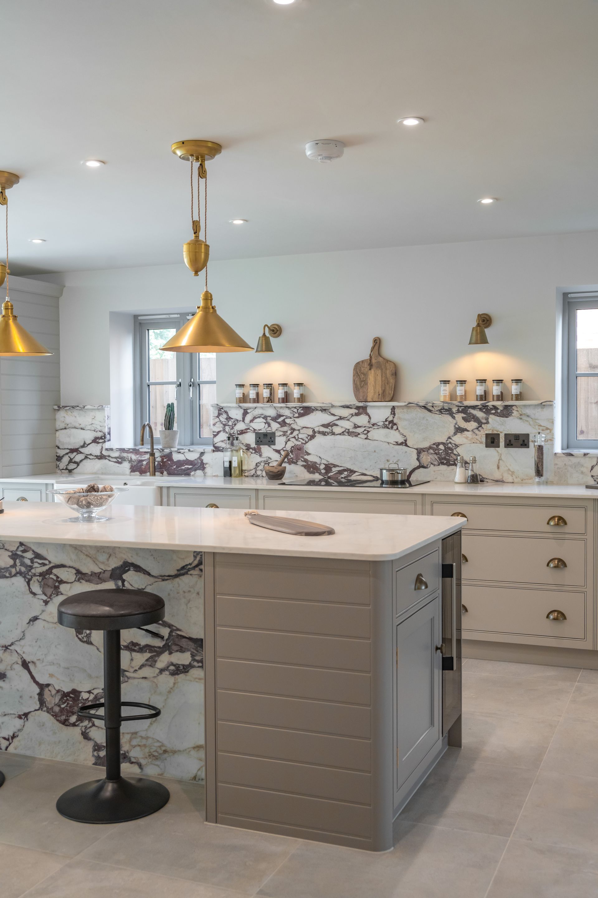 A kitchen with a large island in the middle of the room.