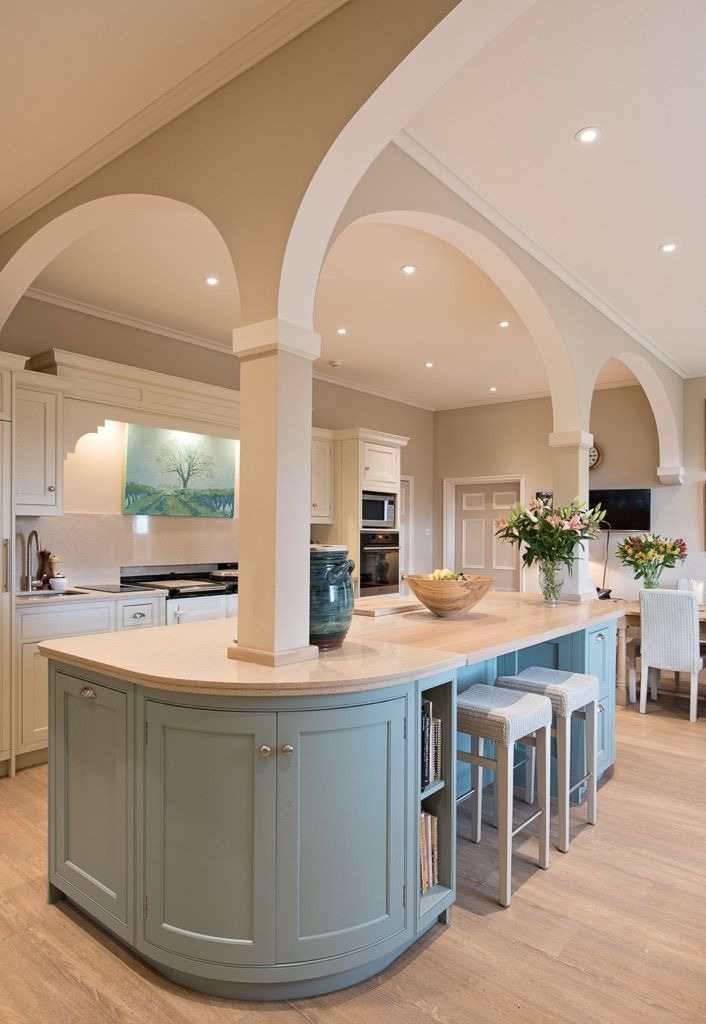 There is a large island in the middle of the kitchen.
