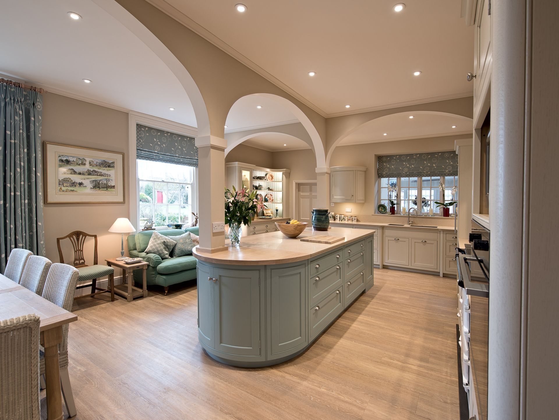 A large kitchen with a large island in the middle of the room.