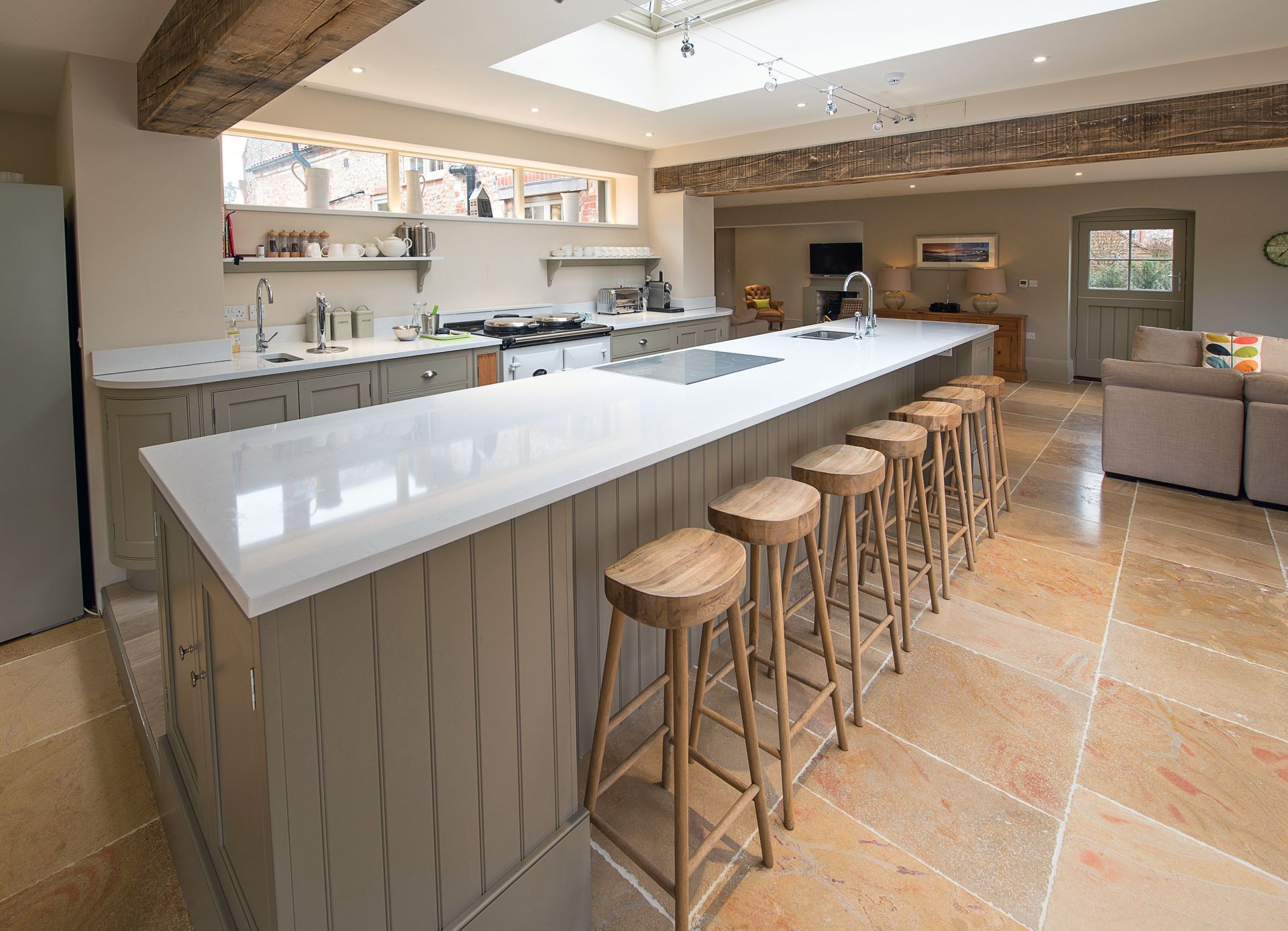 A kitchen with a large island and stools