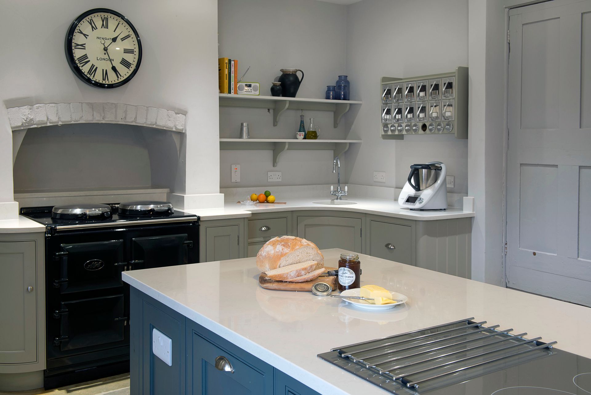 A kitchen with a stainless steel refrigerator and a sink.