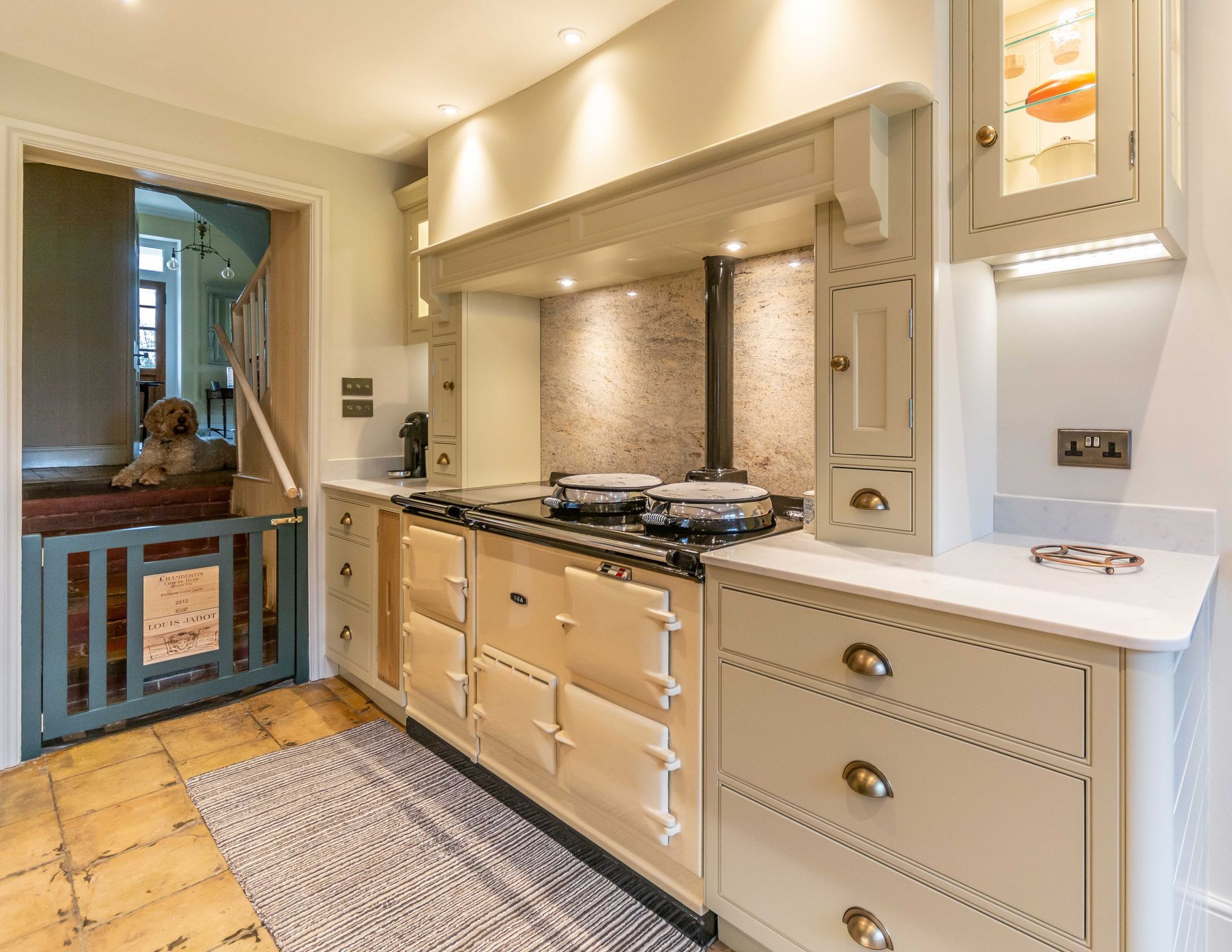 A kitchen with a stainless steel refrigerator and a sink.