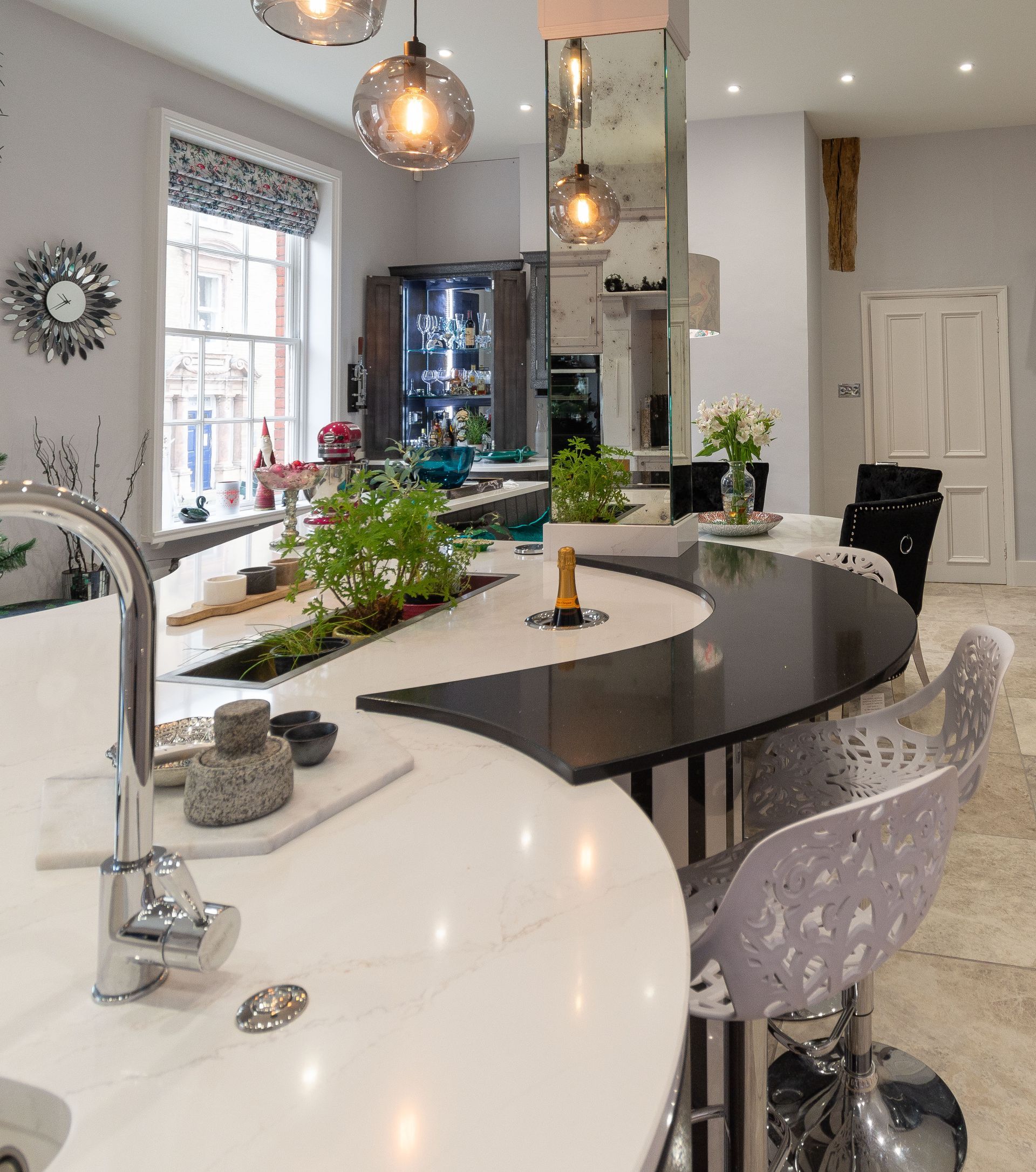 A kitchen with a large counter top and a sink.