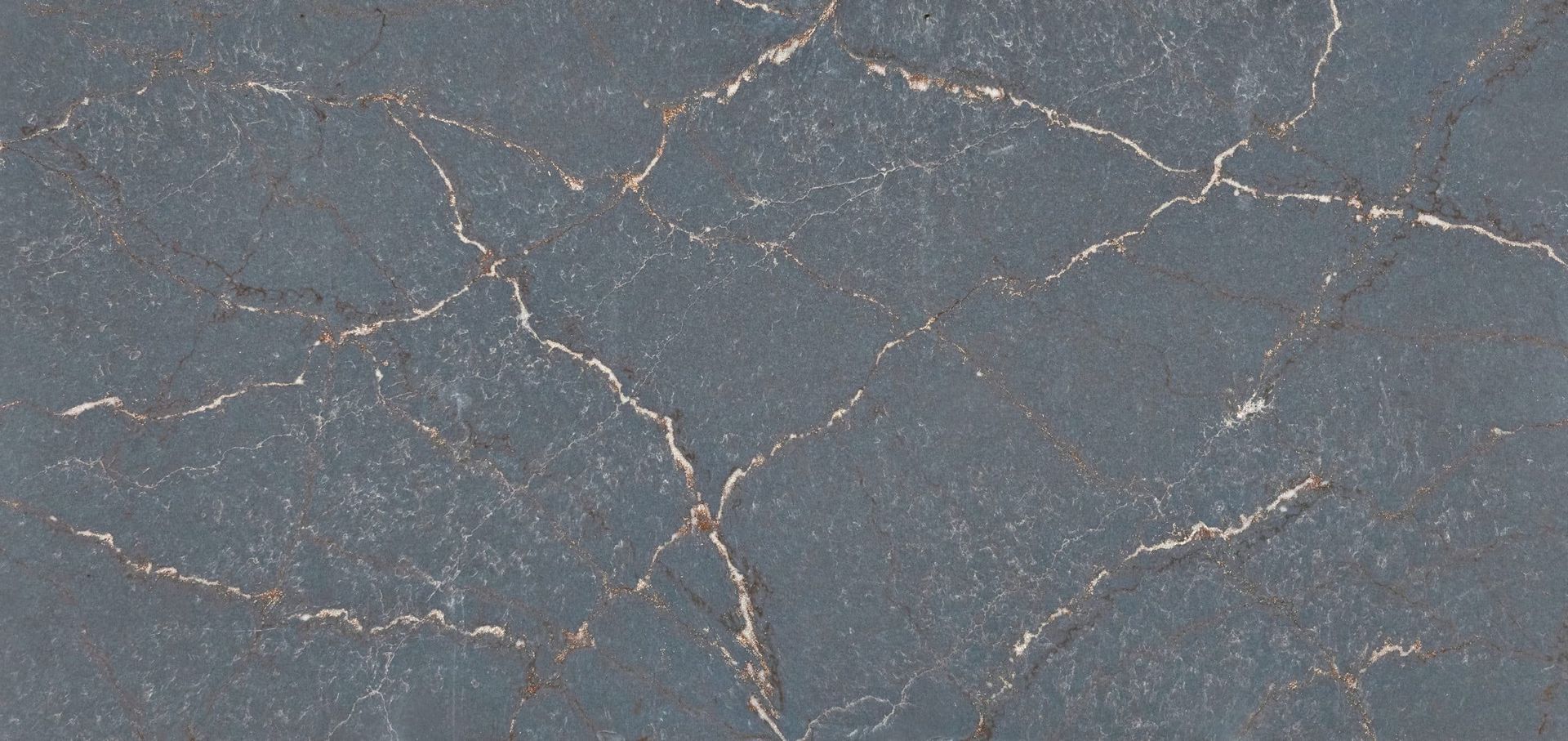 A close up of a cracked concrete surface.