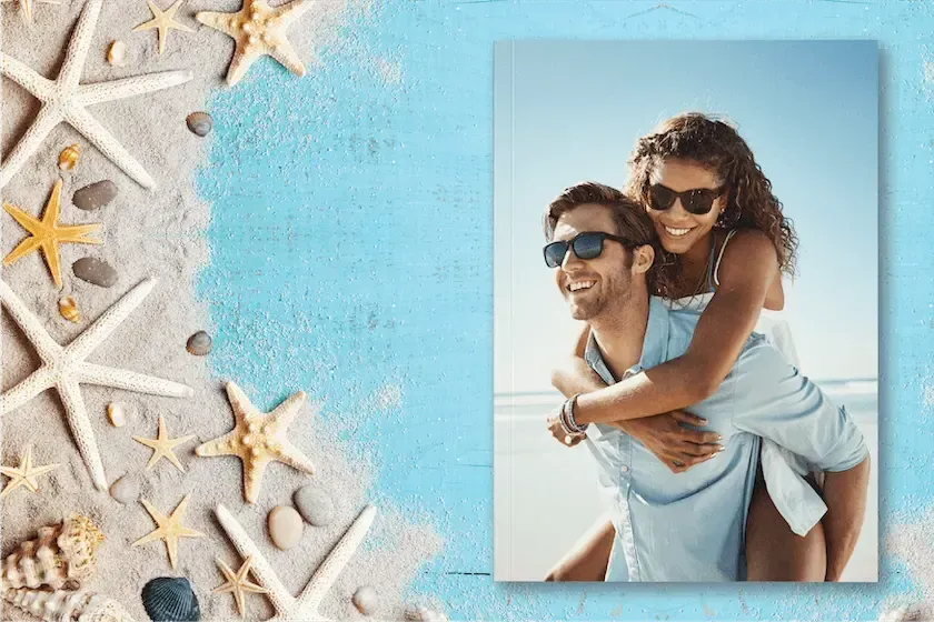 A printed book with a picture of a man and a woman on the beach