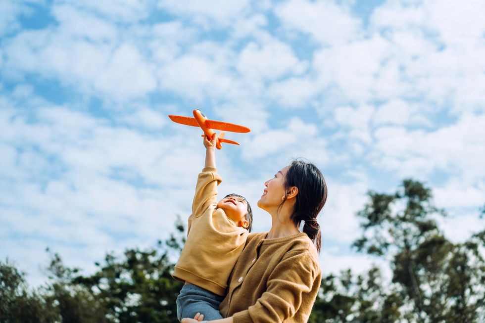 Mother and child with toy plane