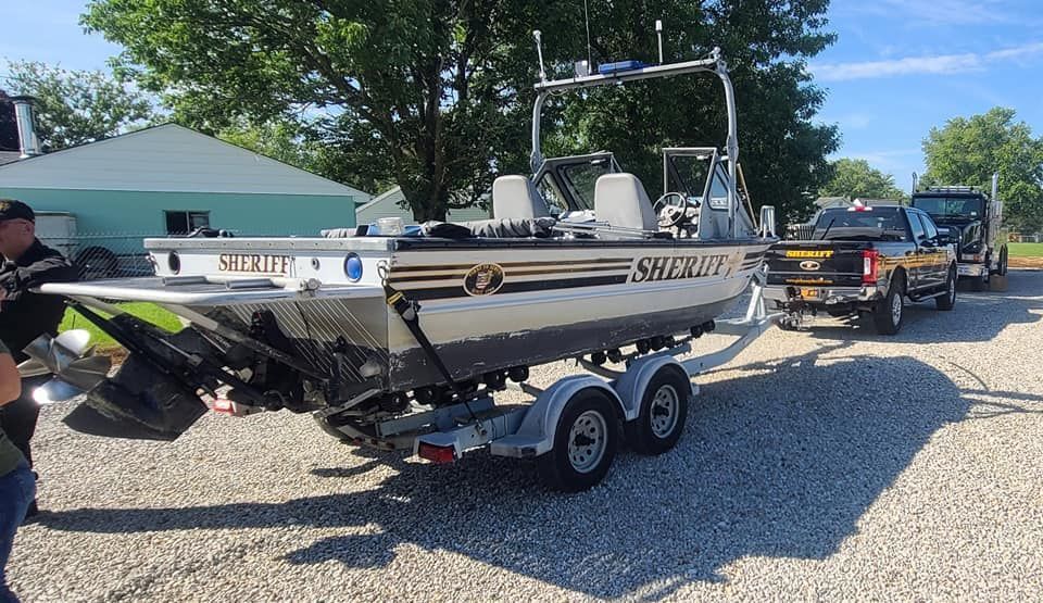 A boat on a trailer that says sheriff on it