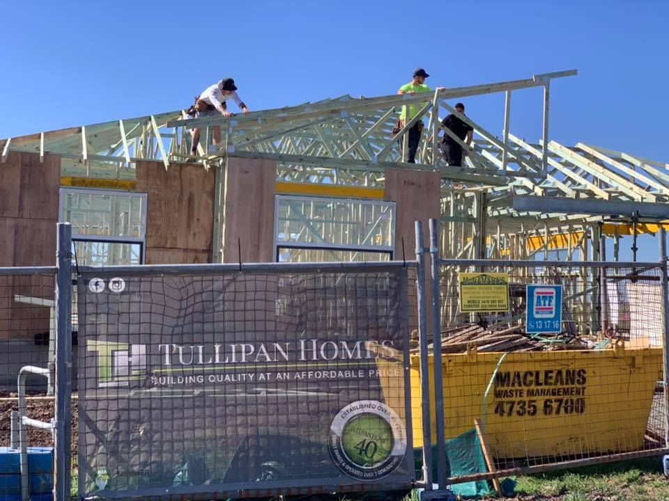 Construction Workers on the Roof of a House Under Construction — McNamara's Frames & Trusses In Forster, NSW