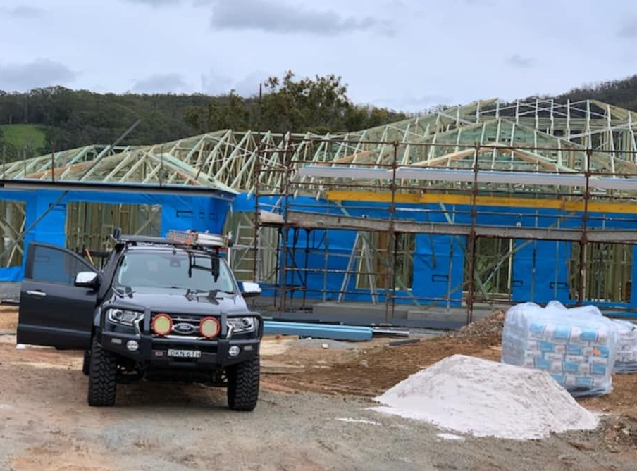 Vehicle Parked in Front of a House Under Construction — McNamara's Frames & Trusses In Port Macquarie, NSW