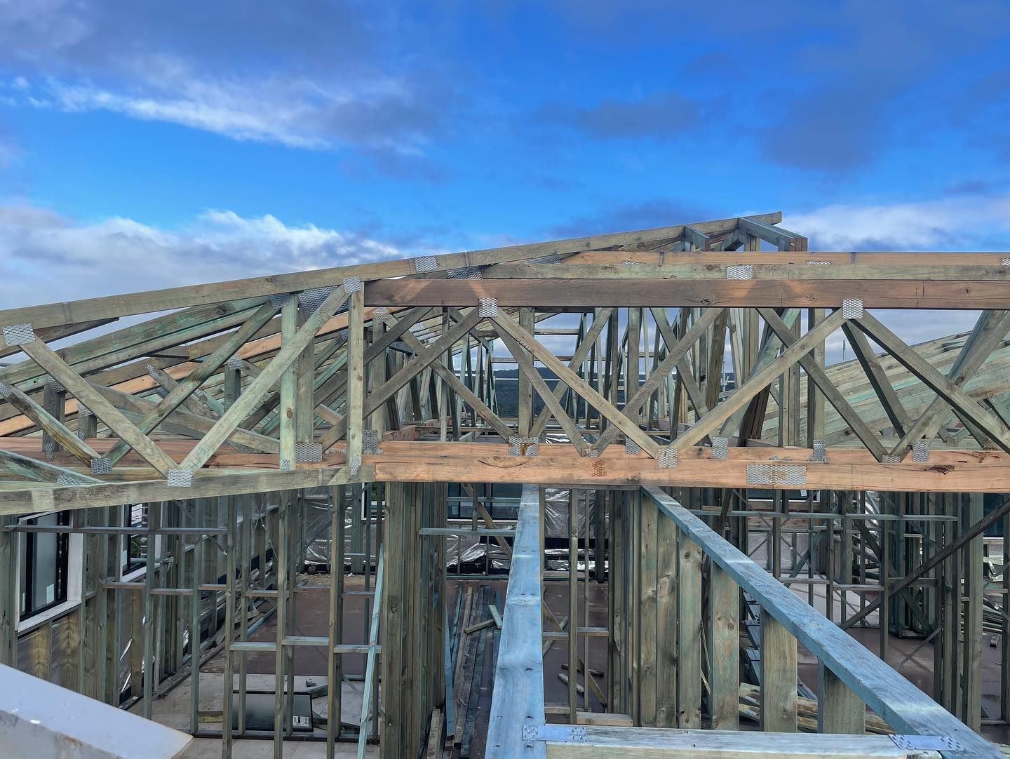Wooden Roof Trusses on a House Under Construction — McNamara's Frames & Trusses In Tuncurry, NSW