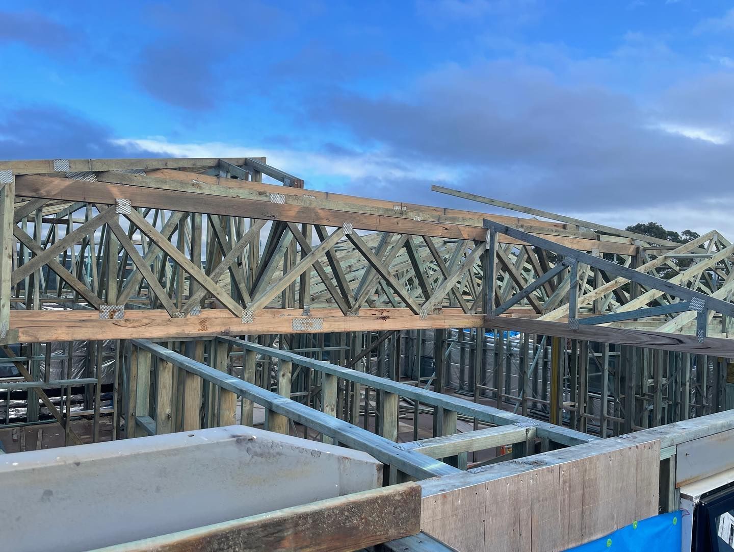 Wooden Trusses on a Building Under Construction — McNamara's Frames & Trusses In Tuncurry, NSW
