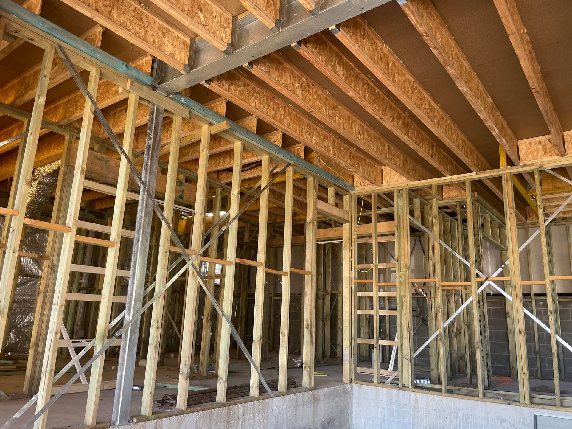 Interior of a Building Showing Wooden Wall and Ceiling Framing — McNamara's Frames & Trusses In Taree, NSW 
