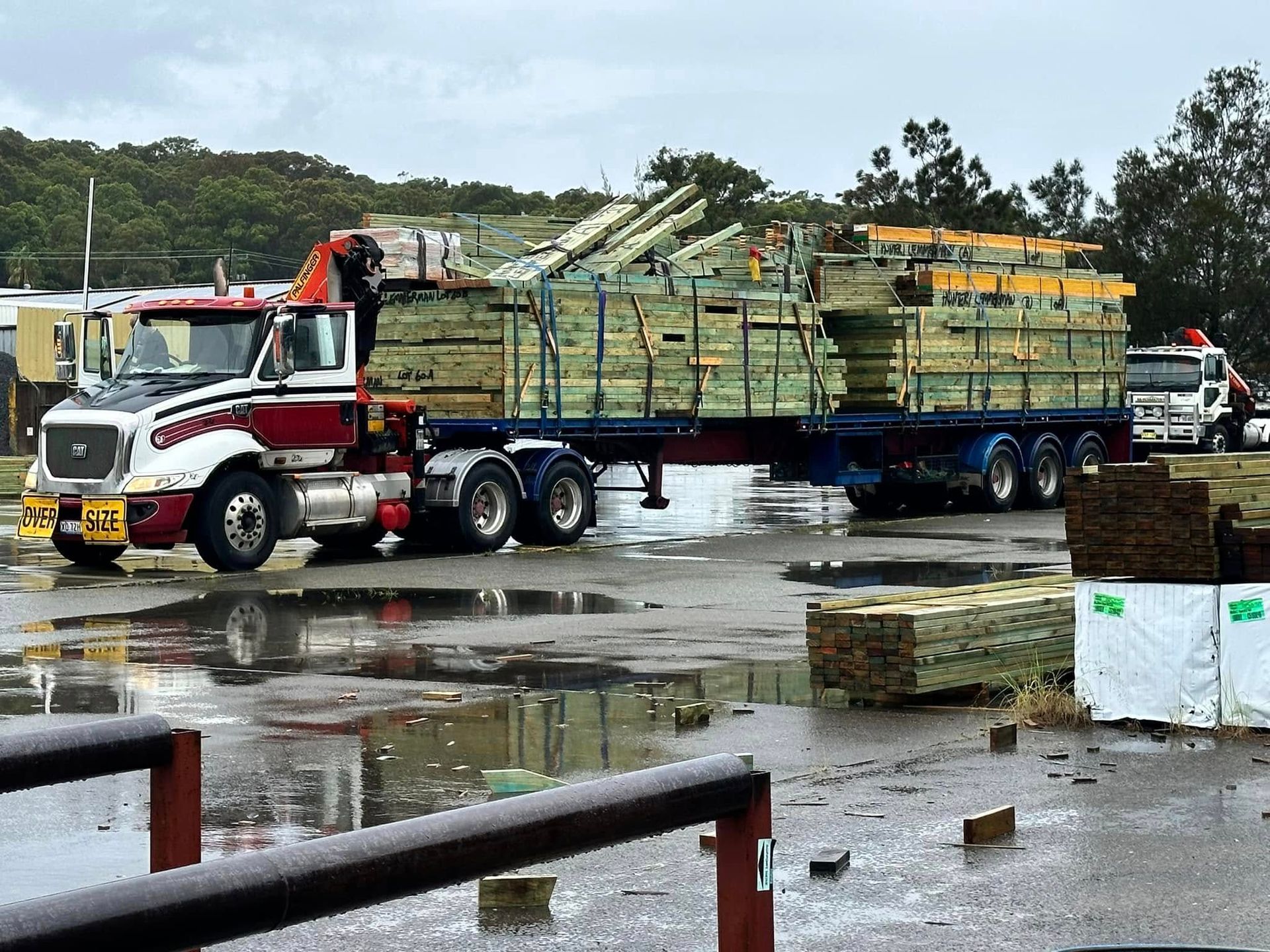 Truck Hauling Lumber on a Rainy Day — McNamara's Frames & Trusses In Forster, NSW