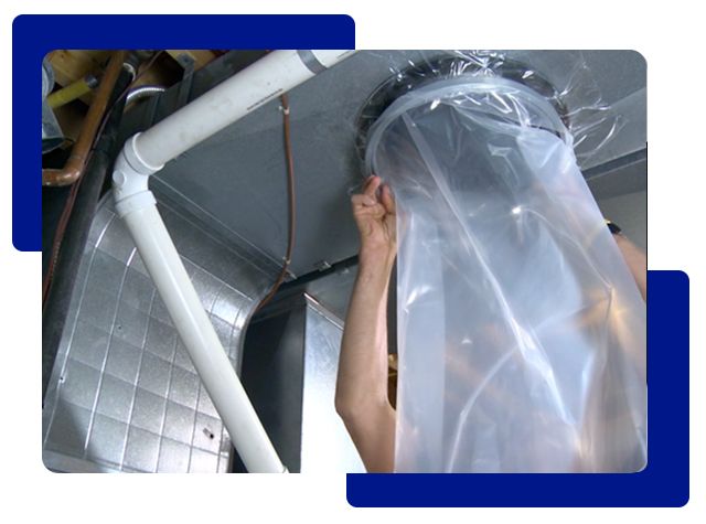 Person inspecting ductwork, head inside a clear plastic bag.