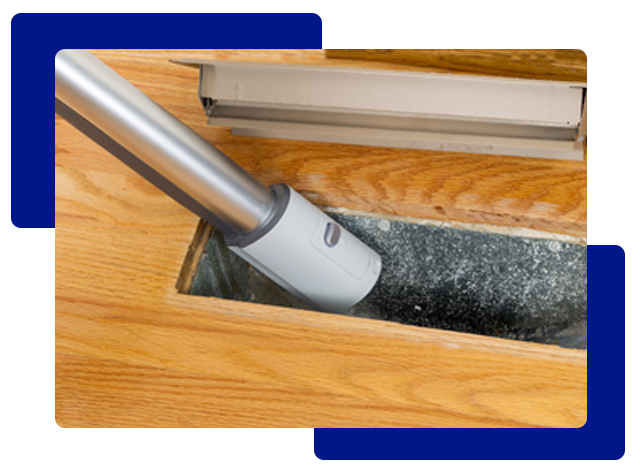 Vacuum cleaning a dusty air vent.