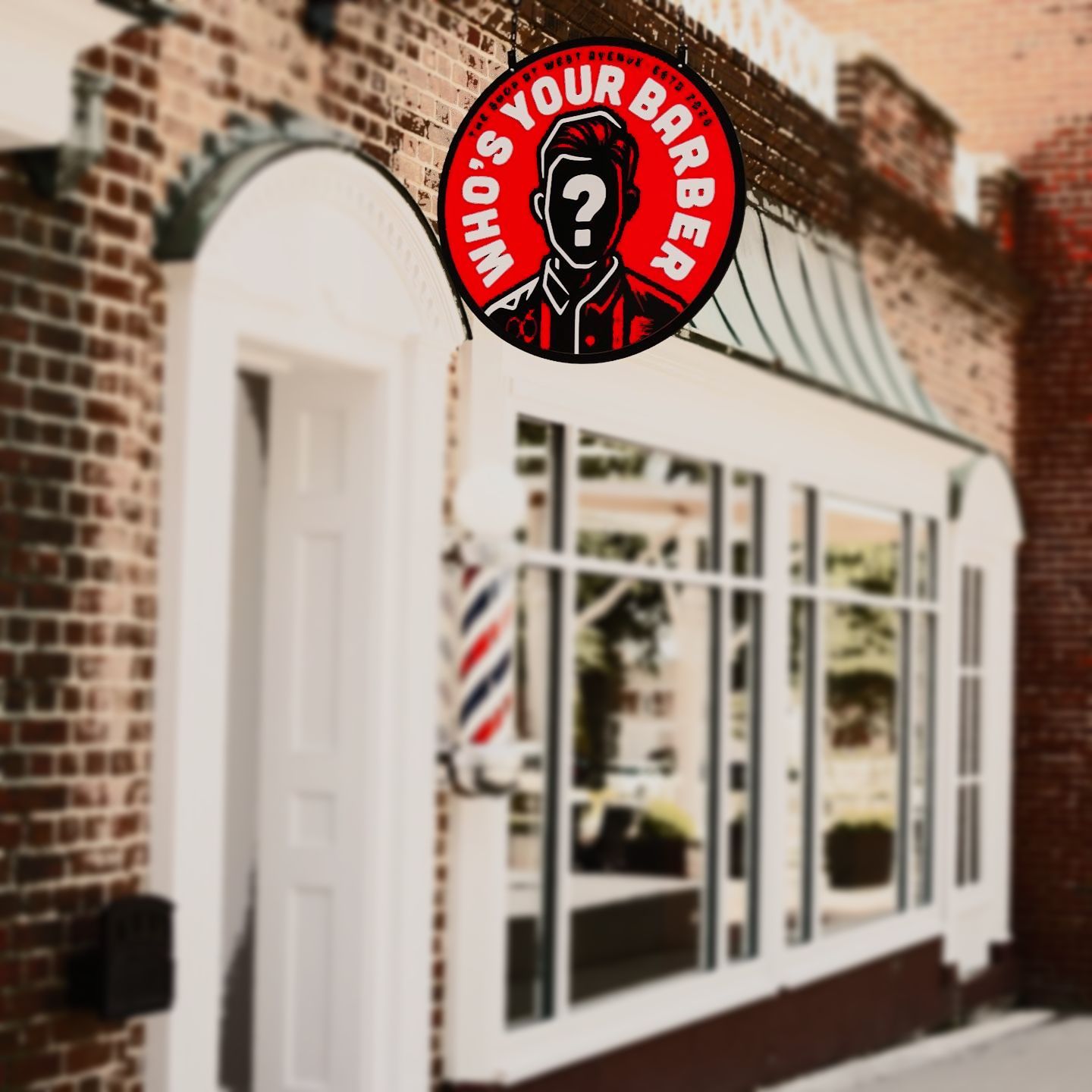 A barber shop with a sign that says who 's your barber