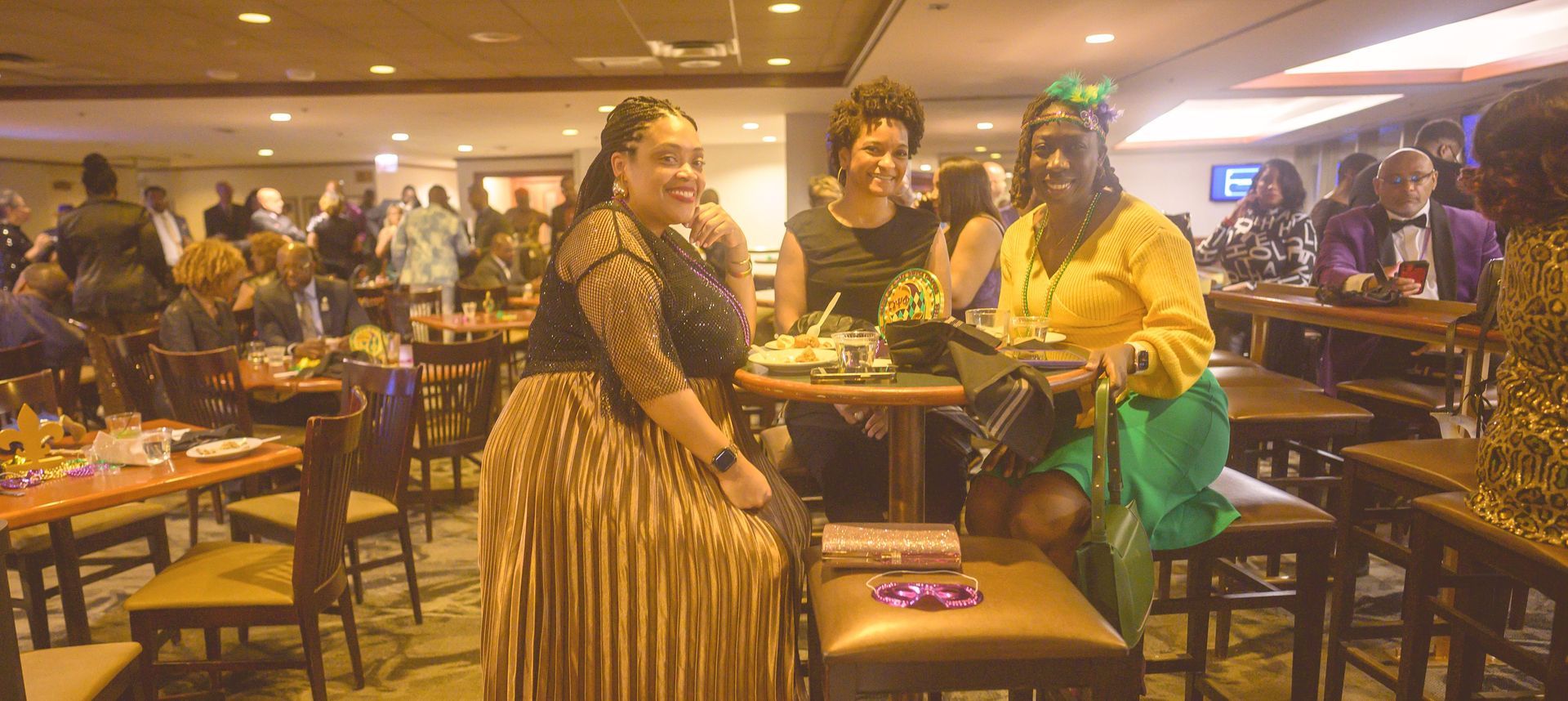 A group of women are sitting at tables in a restaurant.