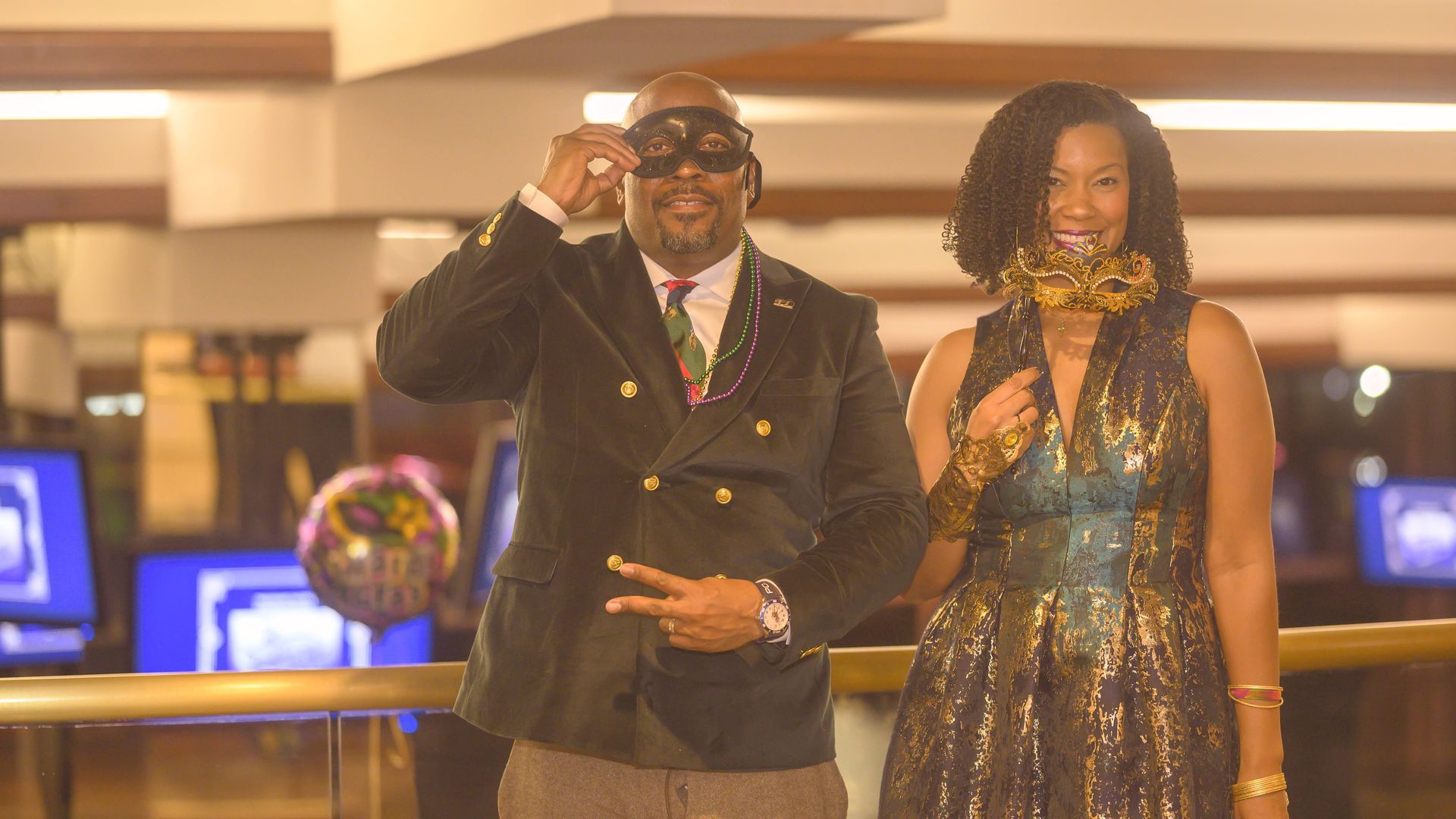 A man and a woman are standing next to each other in a casino.