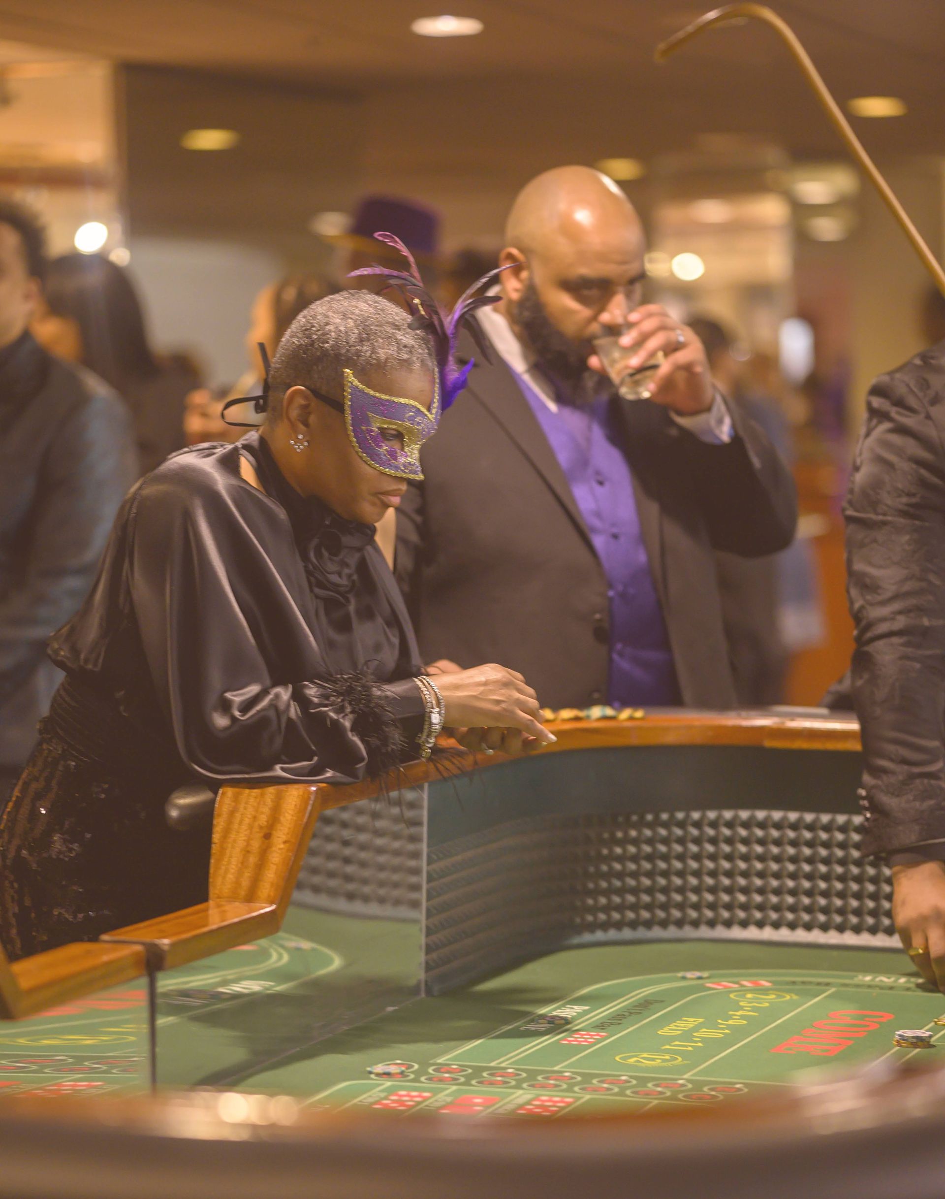 A group of people are playing roulette in a casino