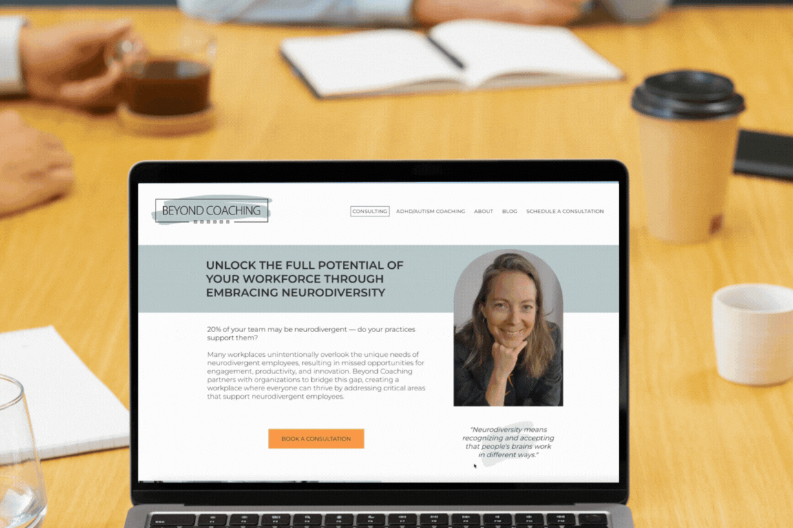 A laptop is open to a website with a woman on it