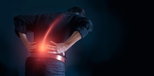 An image showing a man experiencing lower back pain.