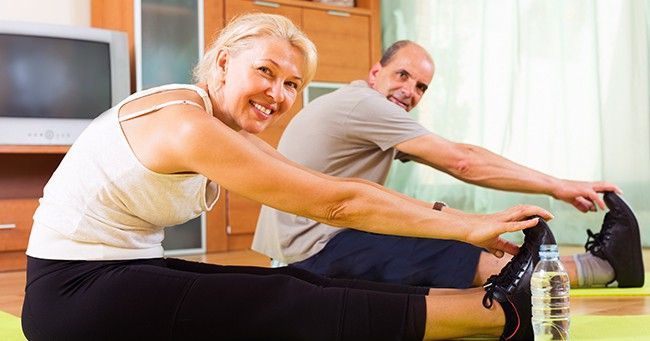 Two people doing yoga.
