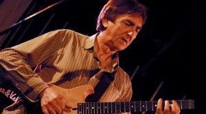 Allan Holdsworth is playing an electric guitar through a Theta Pro DSP