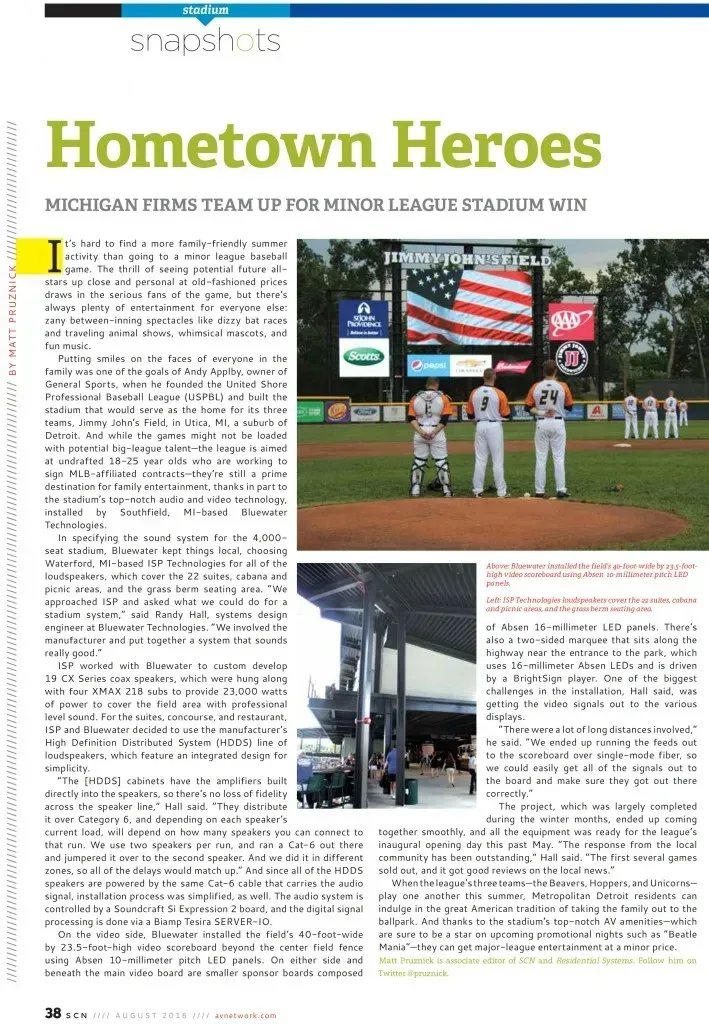 A newspaper article about hometown heroes with a picture of a baseball field.