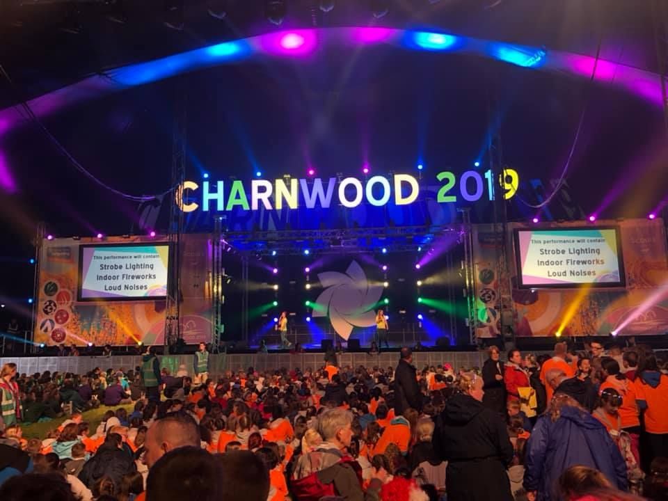 A crowd of people are gathered in front of a stage that says charnwood 2019.