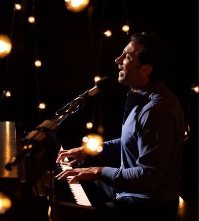 Steve Acho performing music