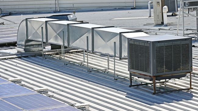 Man Checking Aircon — Sydney, NSW — Enterprise Air Conditioning