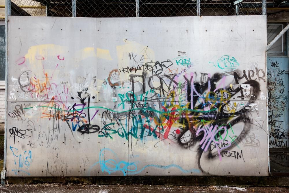 Metal Wall With Graffiti on It and a Chain Link — Capital Ultimate Facility in Belconnen, ACT